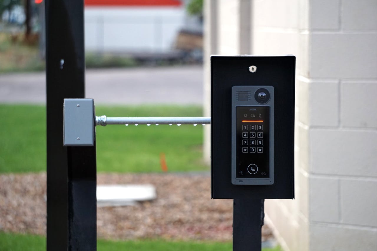 Mastering the First Impression: Your intriguing post title goes here Outdoor intercom mounted at a residential building entrance, ensuring security and communication.